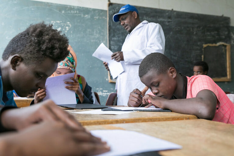 school children reading in braille